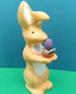Big bunny figure with a flower