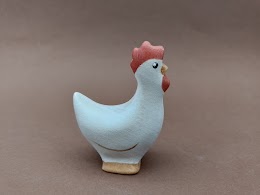 White standing small hen