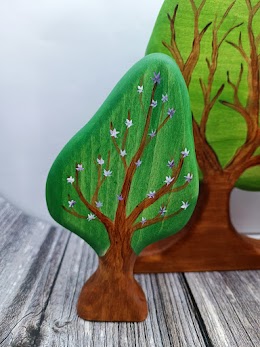 Blooming pear tree. the others side green. M