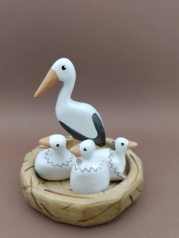 Mother Stork with Chicks in a Nest