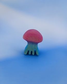 In the dark glow-in-the-dark jellyfish, small, pink-kék